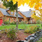 High Peaks Log Homes, og home exteriors, red garage doors